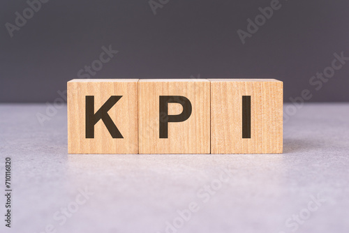 concept word 'KPI' on cubes on a beautiful grey background. business concept, copy space