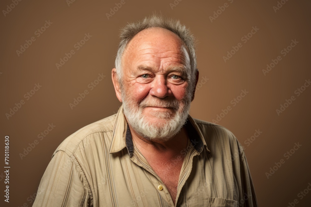 Portrait of a senior man with grey beard and mustache. Studio shot. Portrait of a senior man with grey beard and mustache. Studio shot.
