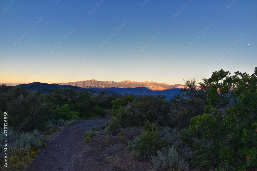 Obraz premium Lone Peak hiking trail view and surrounding landscape from Jacob’s Ladder, Wasatch Rocky Mountains, Utah, United States.