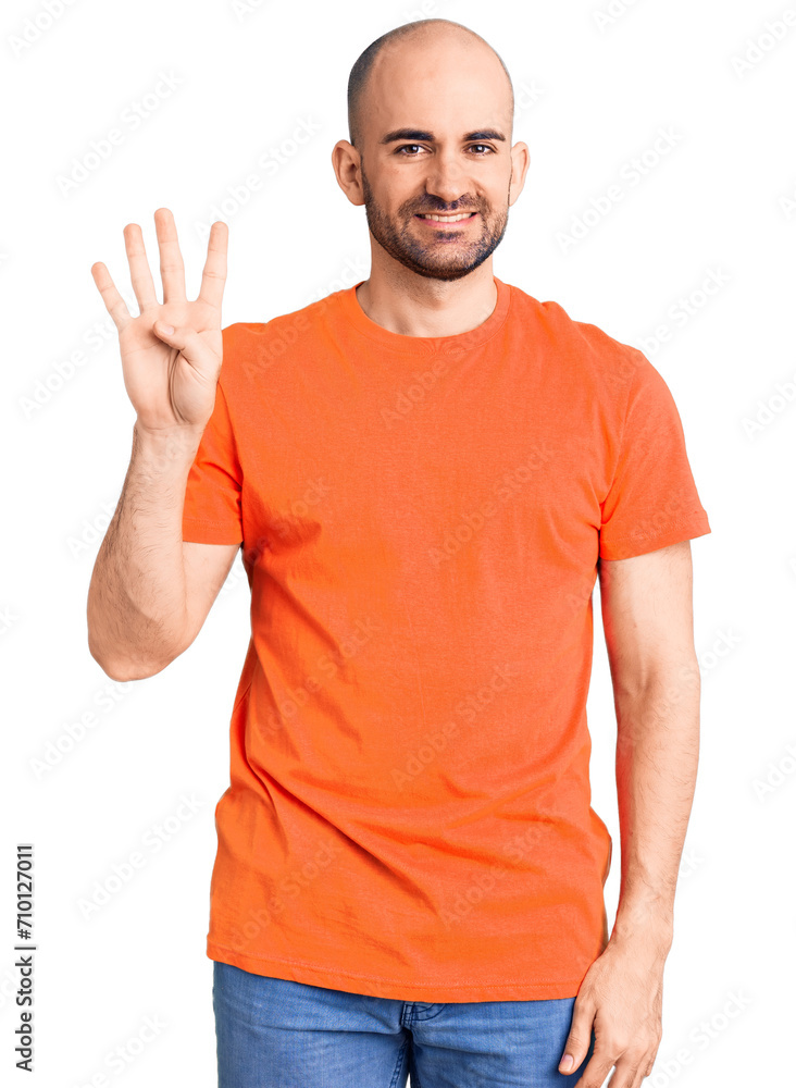 Young handsome man wering casual t shirt showing and pointing up with fingers number four while smiling confident and happy. Young handsome man wering casual t shirt showing and pointing up with fingers number four while smiling confident and happy.