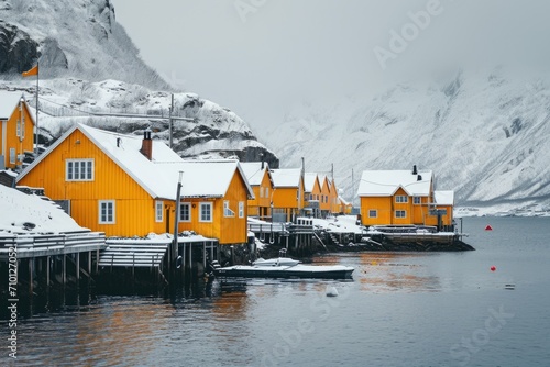 A row of yellow houses sitting next to a body of water. Ideal for real estate, vacation destinations, or waterfront living