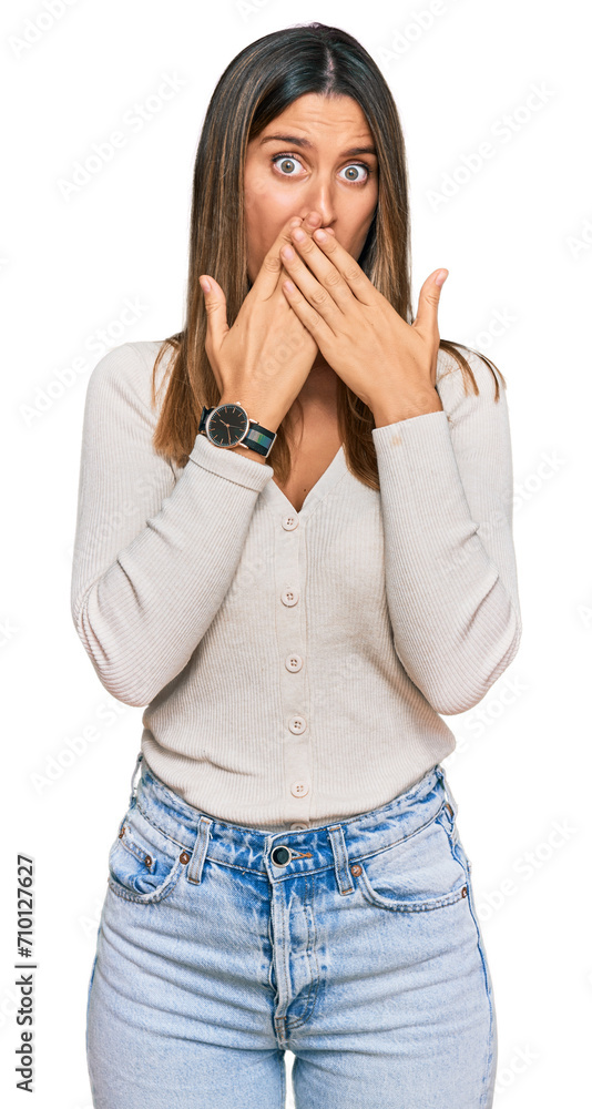 Young woman wearing casual clothes shocked covering mouth with hands for mistake. secret concept. Young woman wearing casual clothes shocked covering mouth with hands for mistake. secret concept.