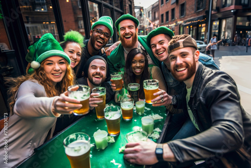 Group of People, Sitting at Table in Pub, on Saint Patty's Day, Having a Good Time, Drinking Beer