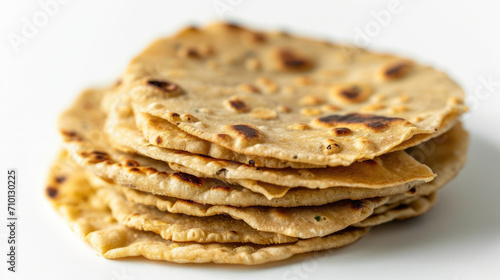 Stack of flat bread sitting on top of white table. Perfect for food blogs or restaurant menus.