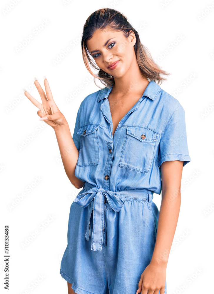 Young beautiful woman wearing casual clothes showing and pointing up with fingers number three while smiling confident and happy. Young beautiful woman wearing casual clothes showing and pointing up with fingers number three while smiling confident and happy.