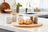 Freshly baked croissants displayed on cutting board on kitchen counter. Perfect for food and bakery-related designs.