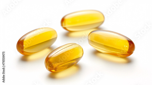 Vitamin E capsules isolated on white background. Antioxidant, radical scavenger, enzyme activity regulator for health and wellness.