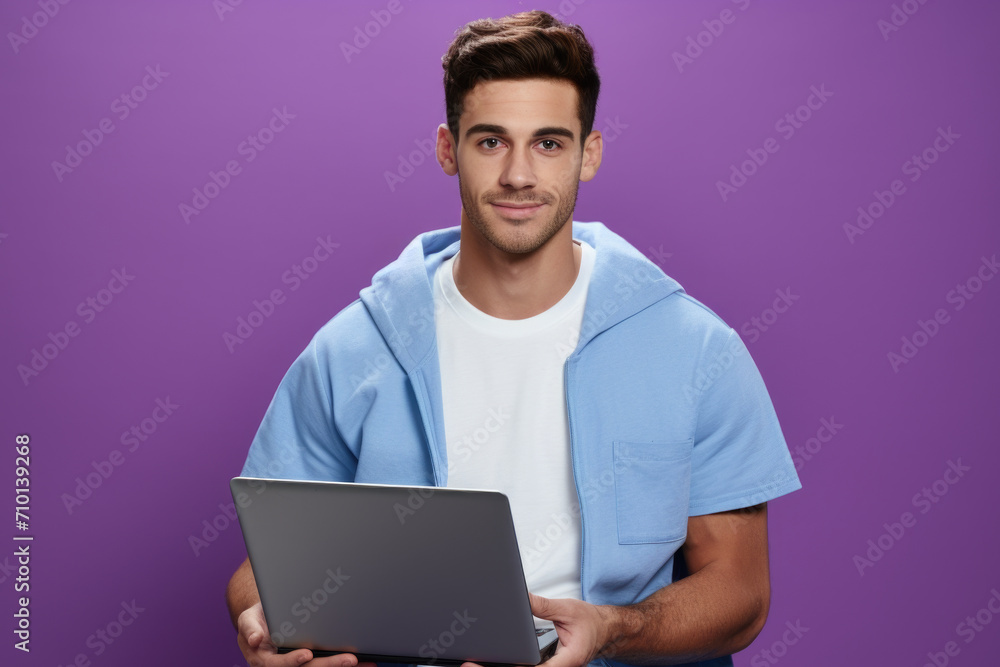 Man wearing blue hoodie holding laptop. Suitable for technology, work, or casual lifestyle themes. Man wearing blue hoodie holding laptop. Suitable for technology, work, or casual lifestyle themes.