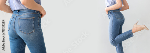 Young woman wearing stylish jeans pants on light background