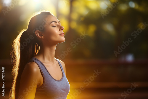 Woman with her eyes closed enjoying warmth of sun. Perfect for relaxation and self-care concepts.