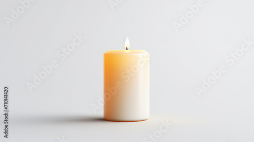White candle is lit on plain surface. Suitable for various uses.
