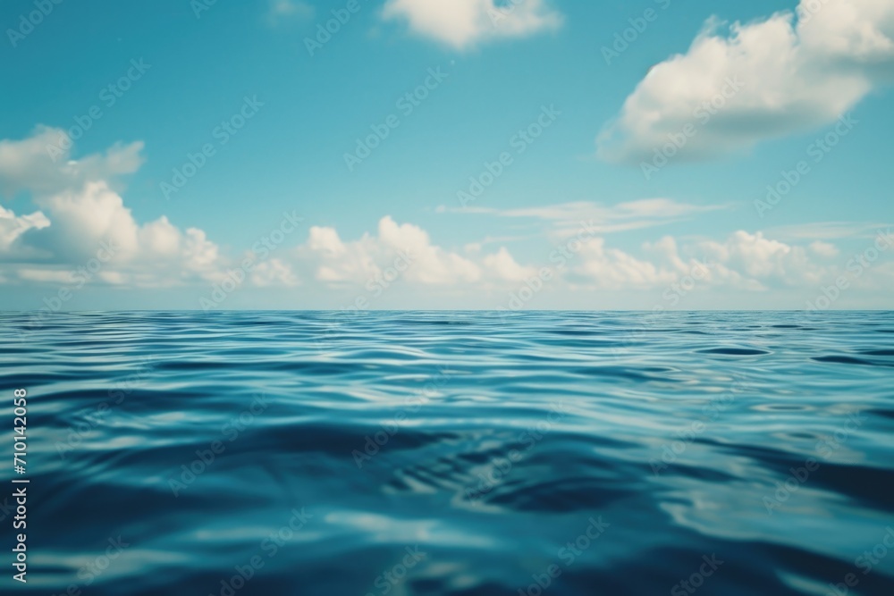 Obraz premium A scenic view of a body of water with clouds in the sky. Perfect for nature and landscape designs