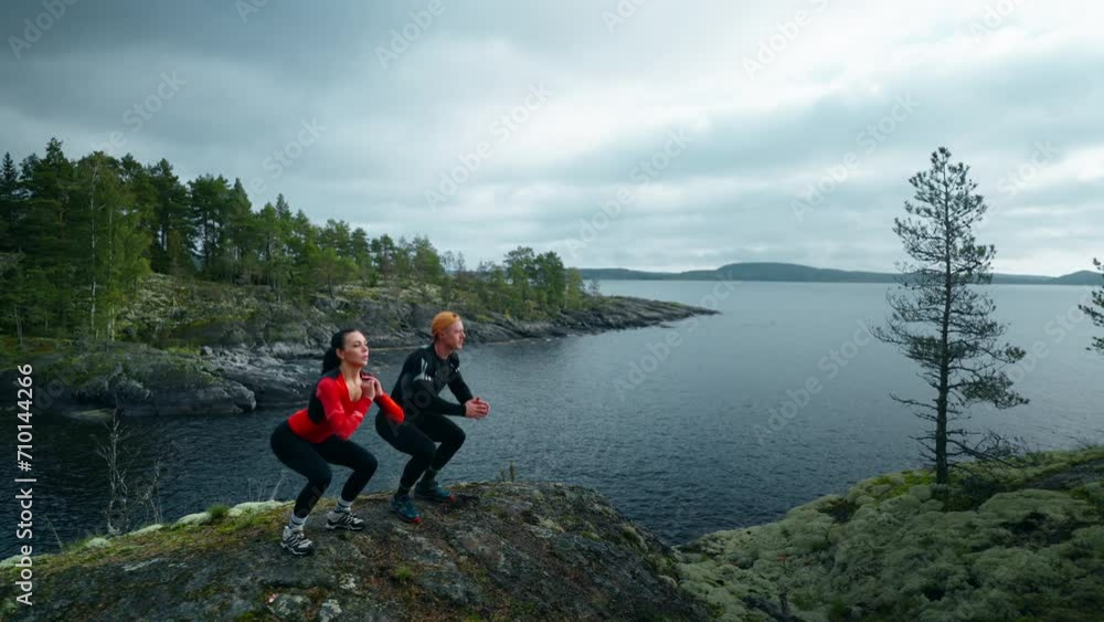Workout In Nature, Athletic Man And Woman Training Together At Top Of Mountain, Healthy Lifestyle Workout In Nature, Athletic Man And Woman Training Together At Top Of Mountain, Healthy Lifestyle