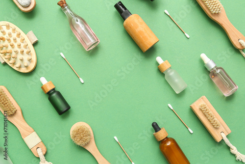 Frame made of cosmetic products and bath supplies on color background