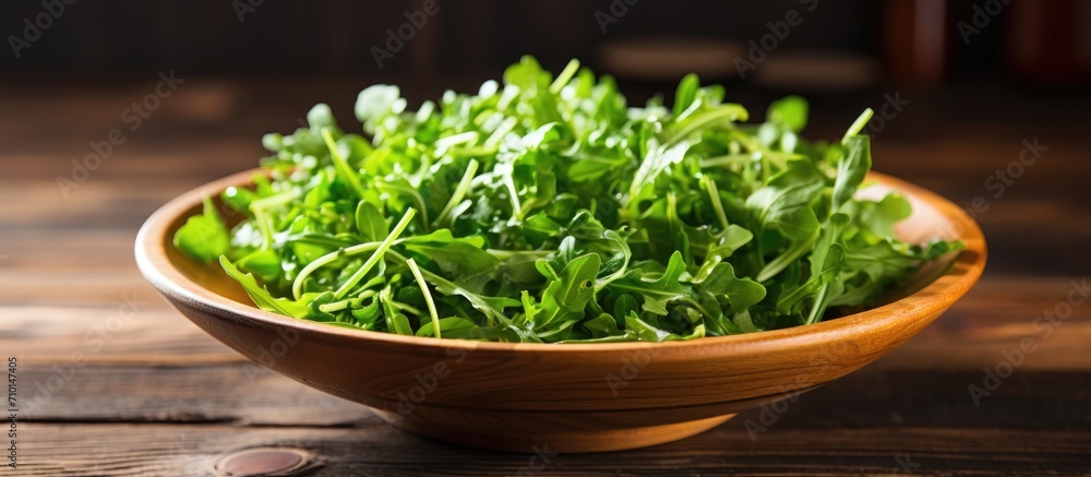 Arugula salad on wooden table. Arugula salad on wooden table.