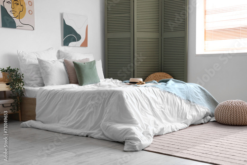 Cozy bed with white blanket...