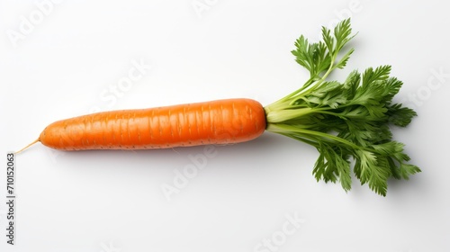 One fresh carrot with tops on white background. Carrot with tops. Food photography. Horizontal format