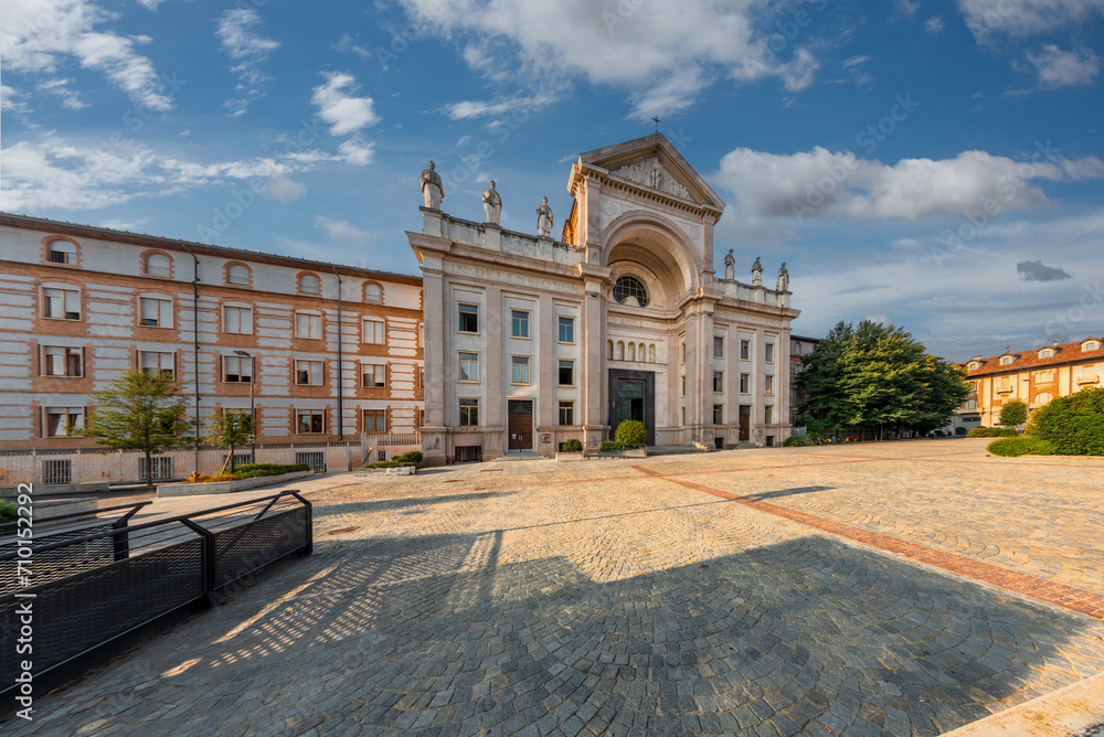 Alba, Italy - August 20, 2023: view of St. Paul's Square with the temple of St. Paul and the building housing the religious institute Societa San Paolo
