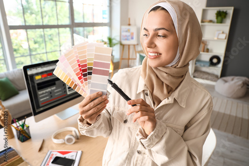 Muslim interior designer with color palettes in office photo