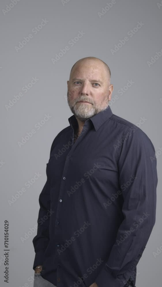 Portrait of well dressed man in a studio portrait looking positive into the camera. Portrait of well dressed man in a studio portrait looking positive into the camera.