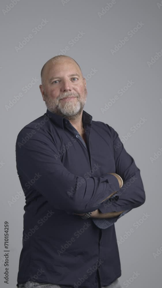 Portrait of well dressed man in studio with positive attitude looking into camera. Portrait of well dressed man in studio with positive attitude looking into camera.