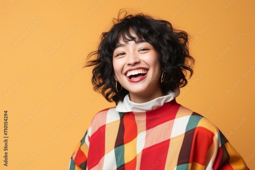Portrait of a happy asian woman with curly hair on colorful background Portrait of a happy asian woman with curly hair on colorful background