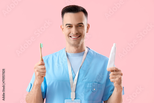 Male dentist with toothbrus...