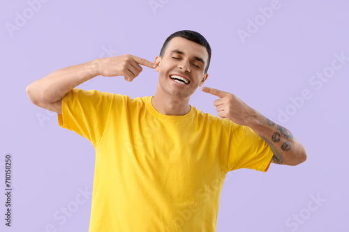 Handsome young man pointing...