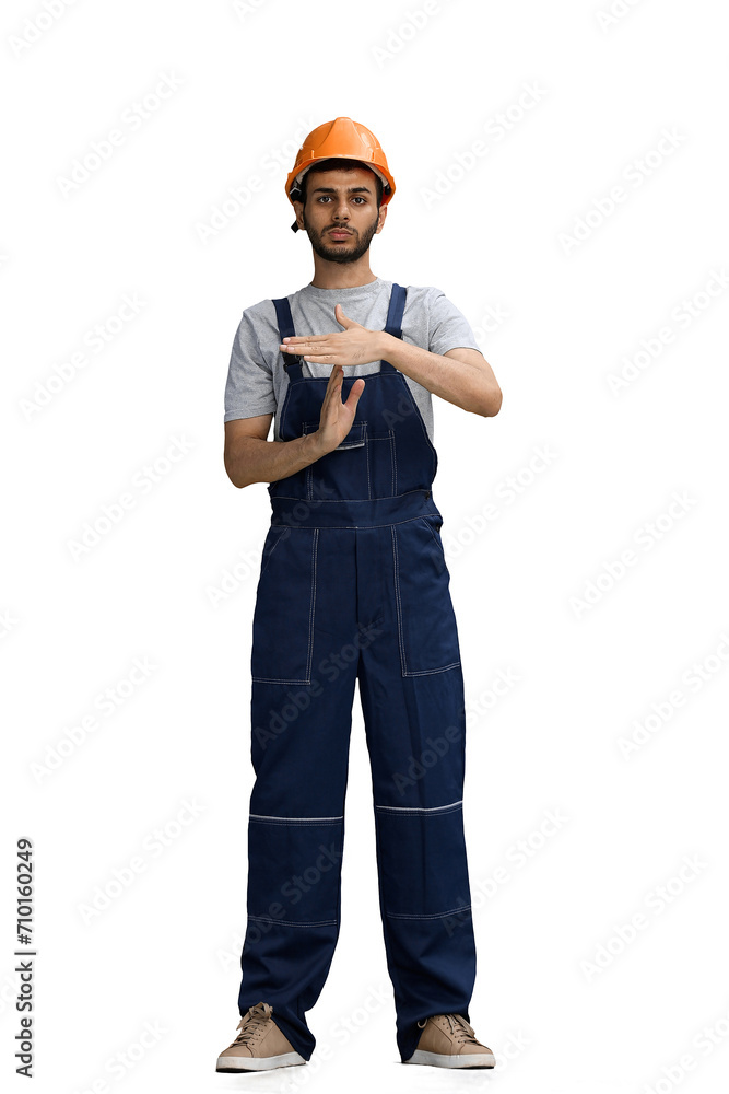 A builder male on a white background thinking show stop sign A builder male on a white background thinking show stop sign