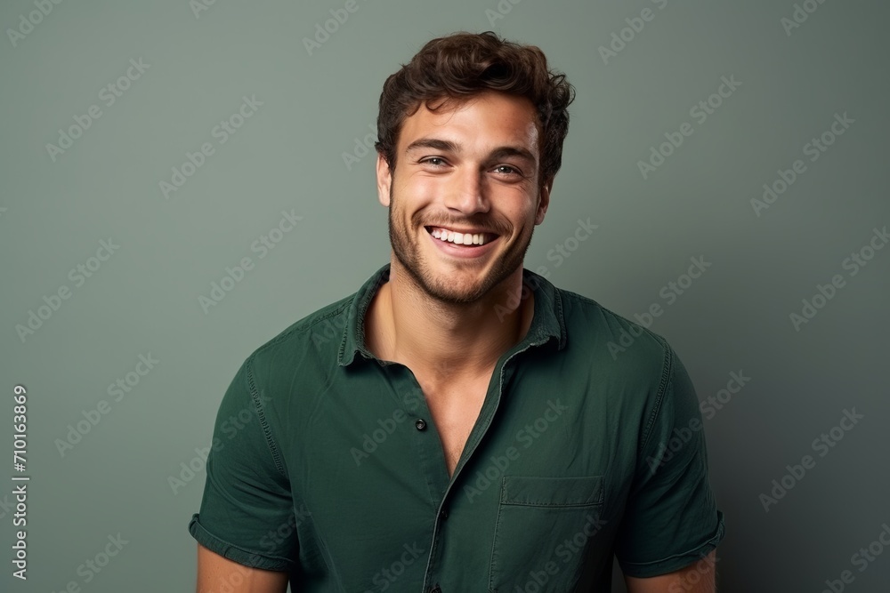 Portrait of a handsome young man smiling and looking at camera. Portrait of a handsome young man smiling and looking at camera.