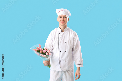 Male chef with tulips on bl...