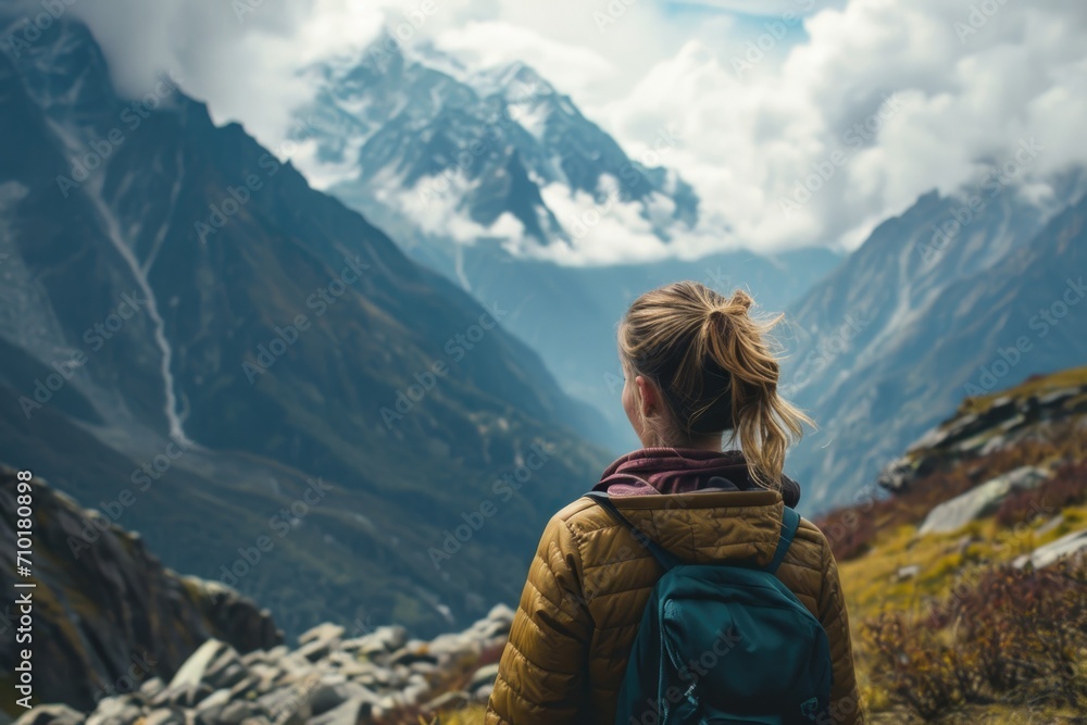 Woman explores mountain range.