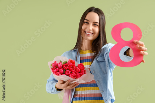 Young woman with bouquet of...