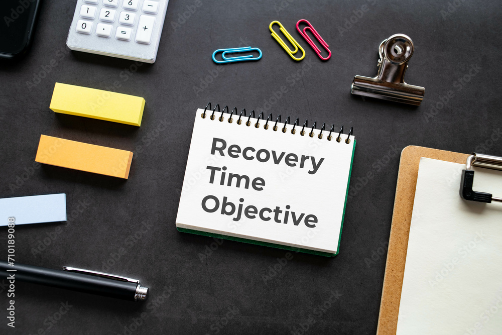 There is notebook with the word Recovery Time Objective. It is as an eye-catching image. There is notebook with the word Recovery Time Objective. It is as an eye-catching image.