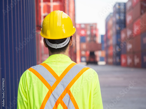 Backside person people human safety hardhat helmet yellow color container logistic cargo box import export custom construction headwear transportation engineer labor employee shipping foreman builder 