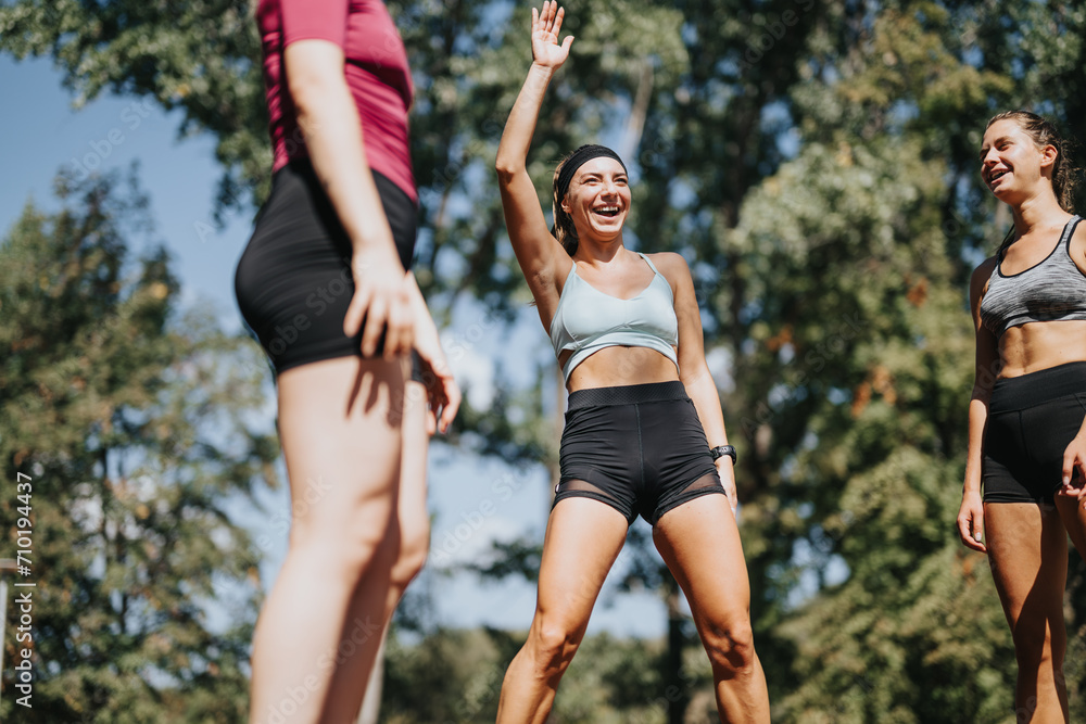 Athletic women exercising outdoors in a sunny park, doing jumps and stretching their bodies. Their energy and happiness motivate each other in their fitness journey. Athletic women exercising outdoors in a sunny park, doing jumps and stretching their bodies. Their energy and happiness motivate each other in their fitness journey.