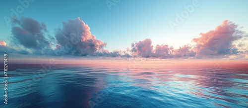 Simplistic aerial ocean sunset view with sky  clouds  and serene water.