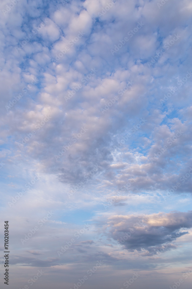 Beautiful epic soft gentle blue sky with white and grey cirrus and fluffy clouds background texture Beautiful epic soft gentle blue sky with white and grey cirrus and fluffy clouds background texture