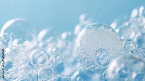 Abstract Soap Foam Bubble Texture on Blue Background - Beauty and Hygiene Concept photo