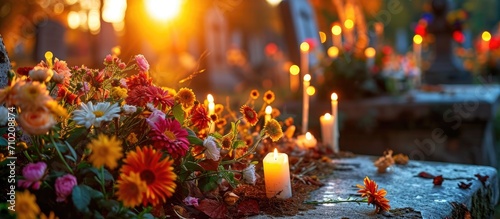 All Saints Day in Slovakia, Europe, with flowers and candles adorning a tombstone in the churchyard.