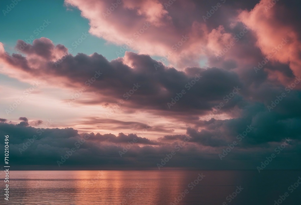 Beautiful cloud over ocean water at sunset in Golden pink blue and green tones Colorful natural land