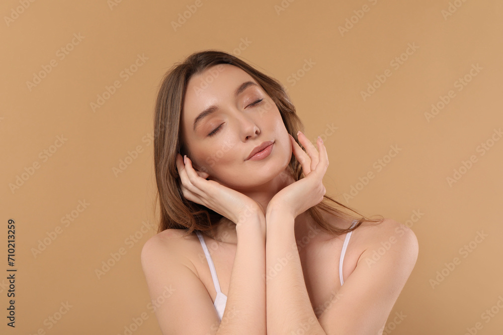 Beautiful woman with healthy skin on beige background Beautiful woman with healthy skin on beige background