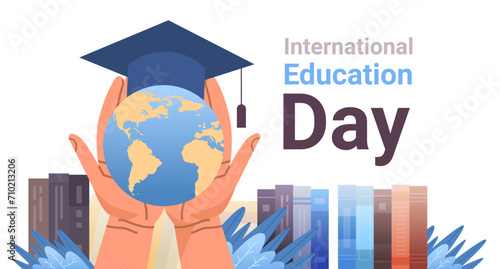 human hands holding globe with graduation cap near books new idea innovation international education day concept