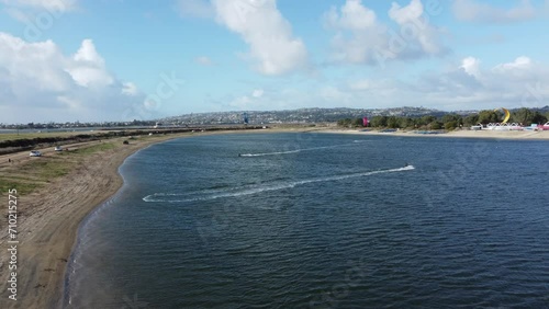 People Kite Surfing On Fiesta Island Park In San Diego, California; Low Aerial Approaching Shot.