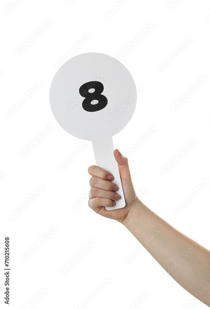 Woman holding auction paddle with number 8 on white background, closeup Woman holding auction paddle with number 8 on white background, closeup
