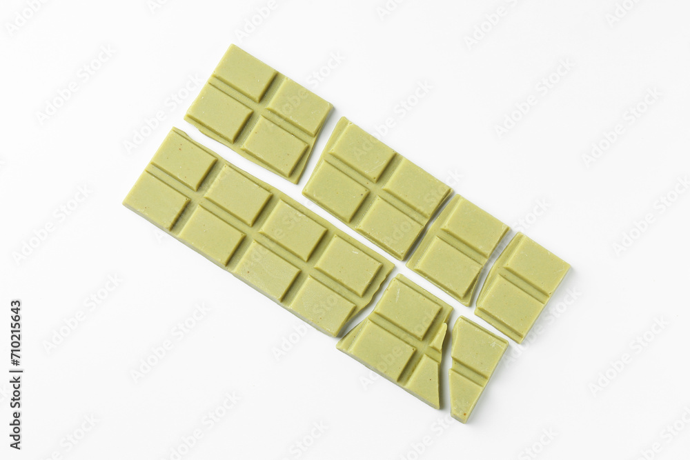 Pieces of tasty matcha chocolate bars on white background, top view Pieces of tasty matcha chocolate bars on white background, top view