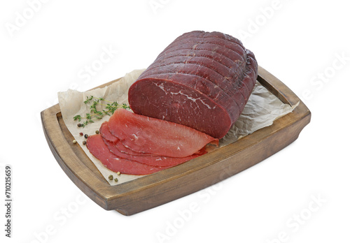 Tasty fresh dry bresaola, peppercorns and thyme isolated on white