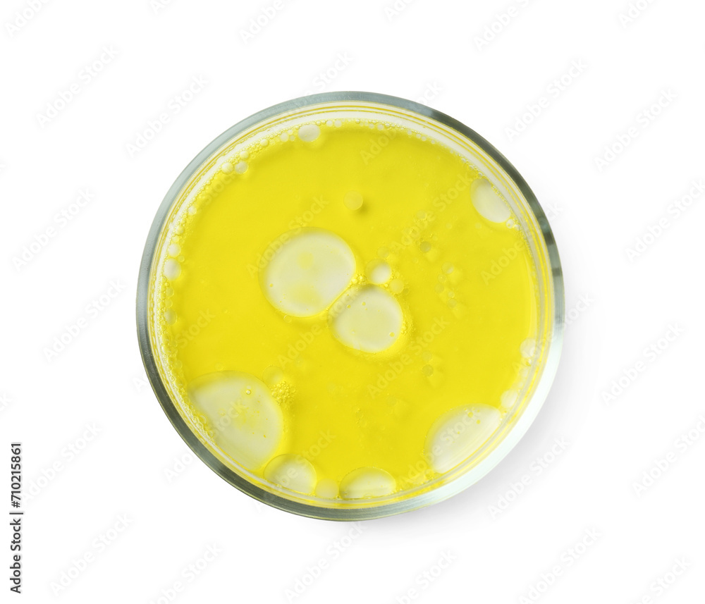 Petri dish with yellow liquid sample on white background, top view Petri dish with yellow liquid sample on white background, top view