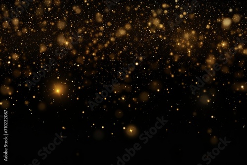 Abstract background with golden glitter effects on black background. Golden glitter for overlay in graphic art. Golden light in bokeh effect. photo