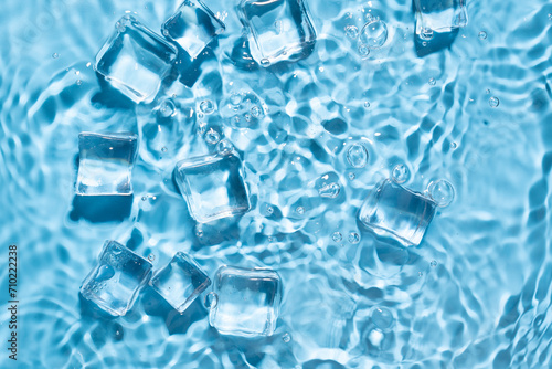 Blue water wave and ice cubes background.